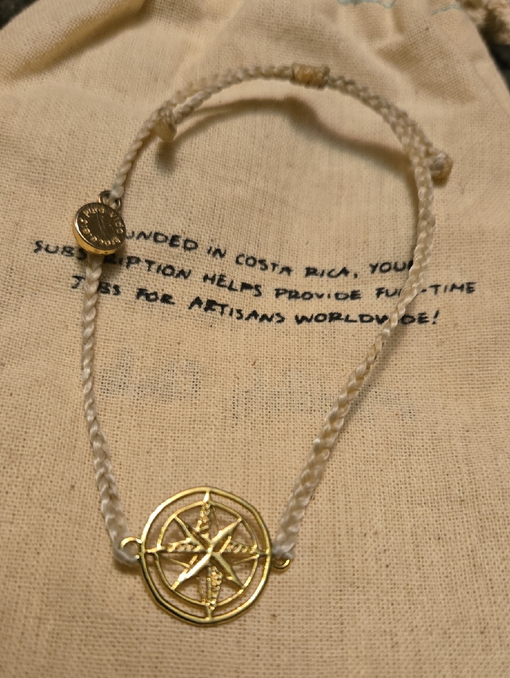 Pura Vida Gold Compass Pendant on Cream Braided Cord Bracelet